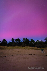 The southern lights in the northern sky as seen from Seven Mile Beach on May 11 2024