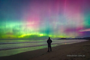 Aurora "selfie" as the southern lights fill the sky above Seven Mile Beach in Tasmania